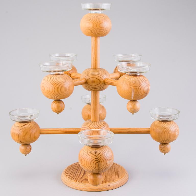 A Finnish wood and glass candelabra, marked Aarikka made in Finland.