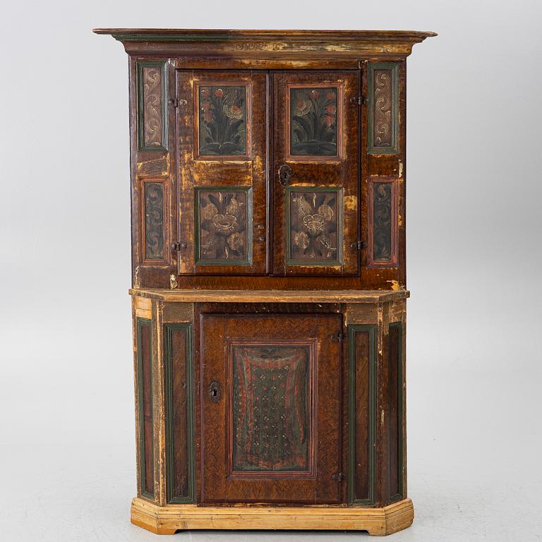 A corner cupboard, dated 1779.