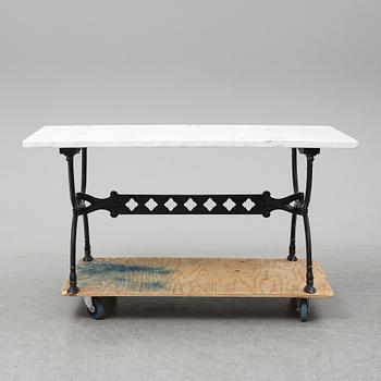 An end of the 20th Century aluminum and marble garden table.