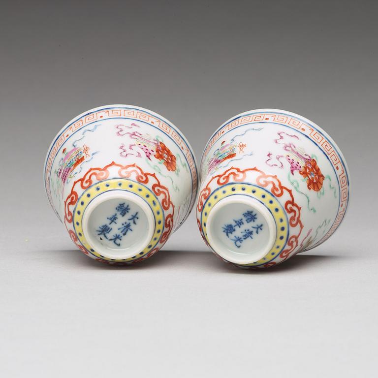 A pair of Chinese famille rose ba jixiang wine cups, Republic, with Guangxu six character mark.