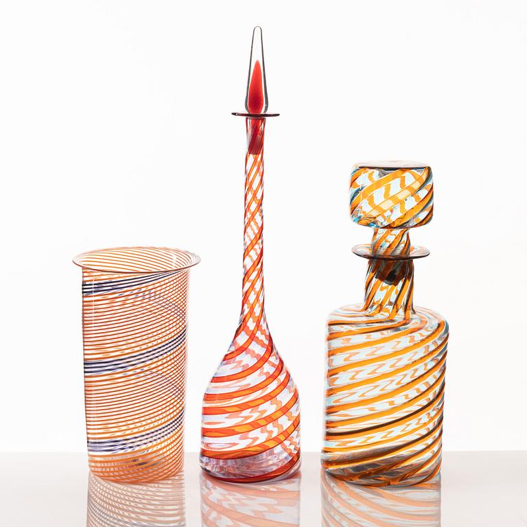 A glass vase and two glass bottles, presumably Murano, Italy.