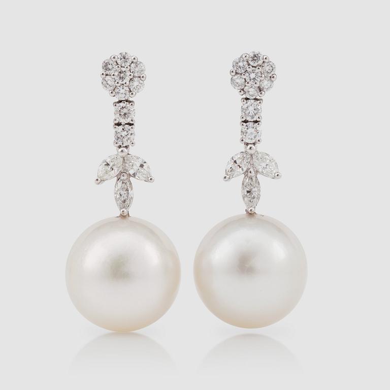 A pair of cultured pearl 14 mm, and diamond 1.47 cts, earrings.