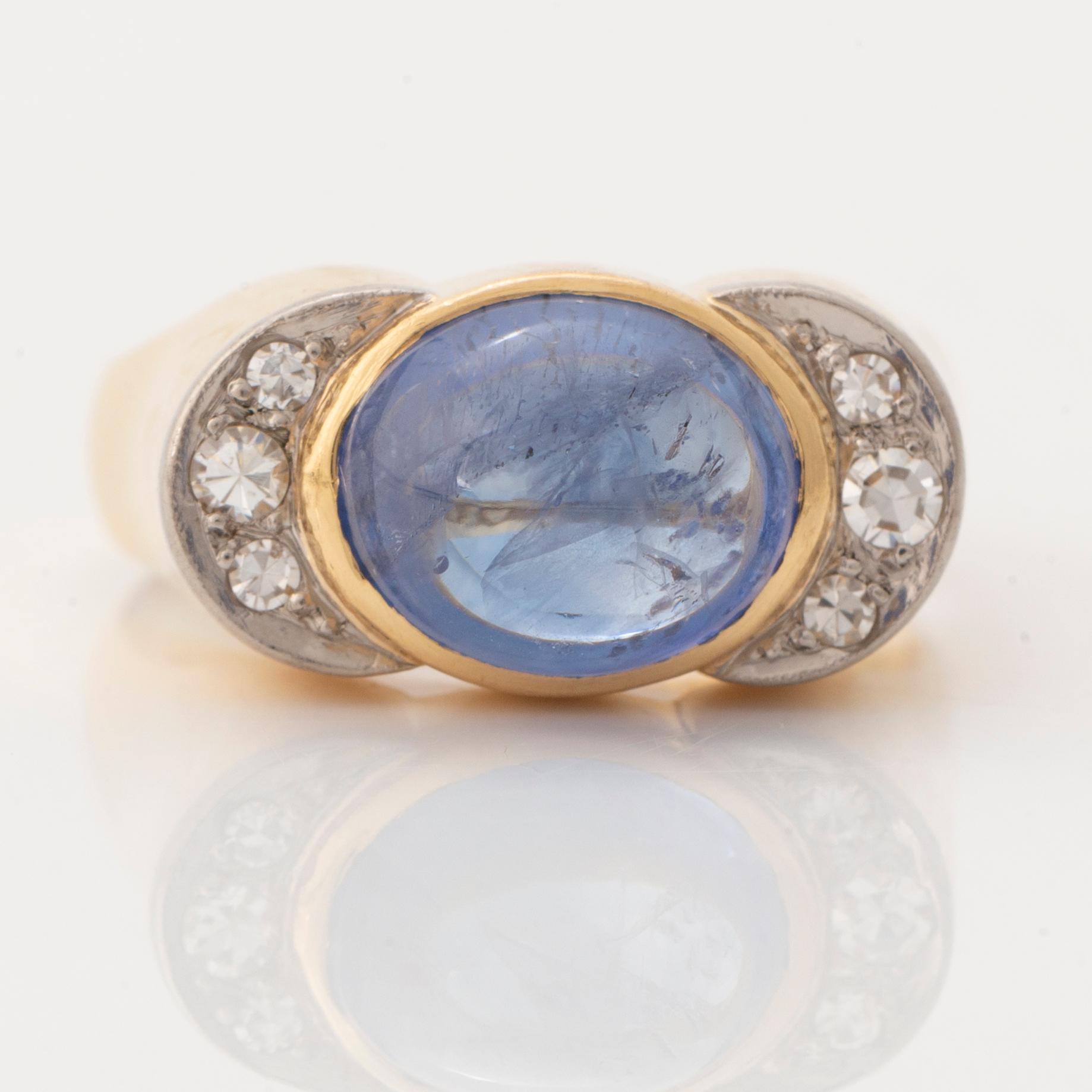 Cabochon cut sapphire and eight cut diamond ring.