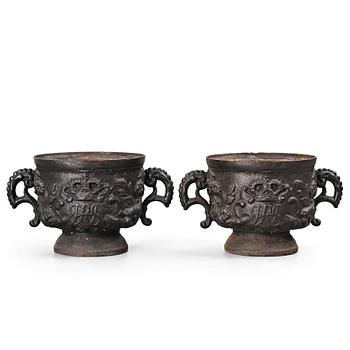 143. A pair of Swedish cast iron plant pot with the monogram of Queen Hedvig Eleonora, probably 1920's.