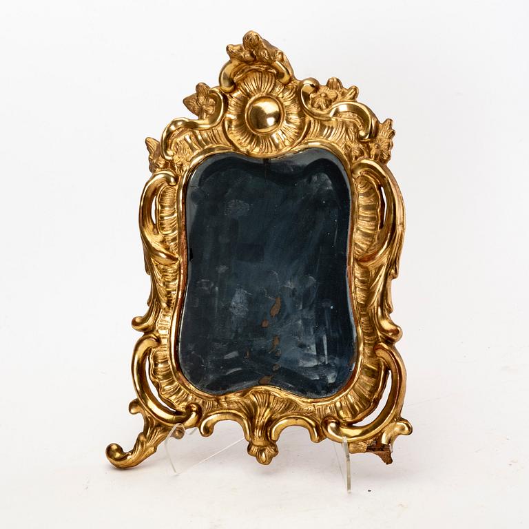 A mid 18th century gilded rococo mirror.