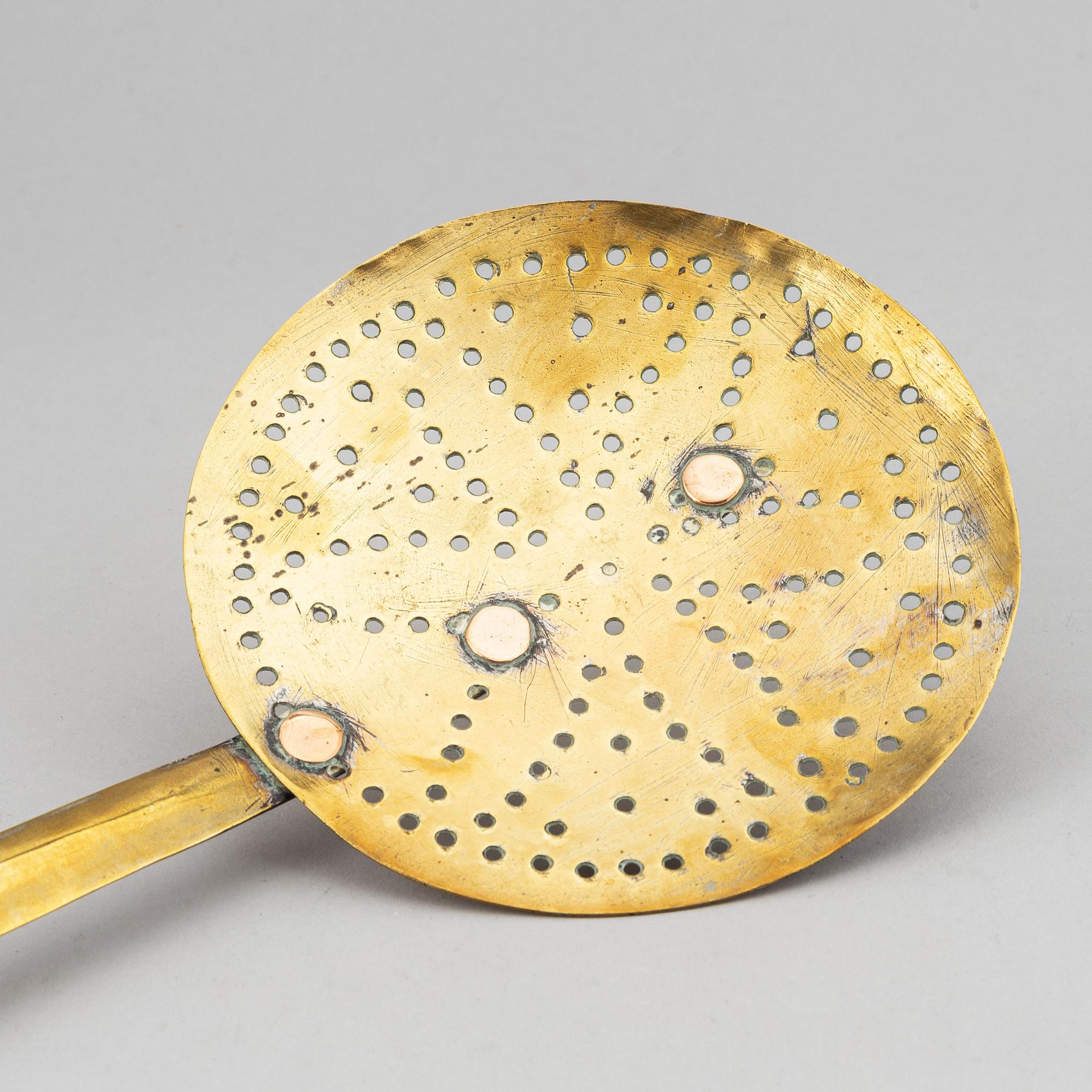 A ladle and sieve, brass, 18th century.