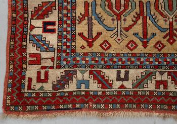 A rug, antique Anatolian/Caucasian, ca 148-149 x 104,5-110 cm (as well as 1-1,5 cm flat weave at one end).