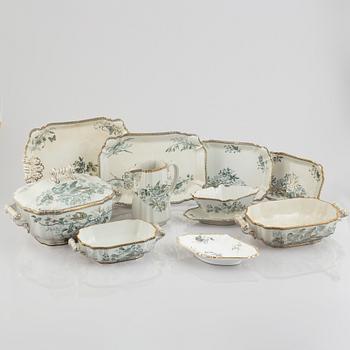 A 124-piece creamware dinner service, "Wexiö guld", Gustavsberg, Sweden, around 1900.