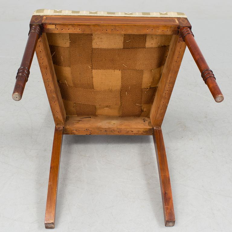 A 1920/30s Swedish Grace sofa, a pair of chairs, a pair of armchairs and a table veneered with mahogany.