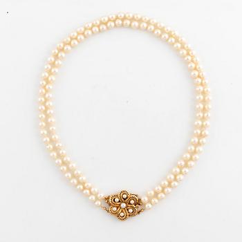 Cultured two strand pearl necklace.