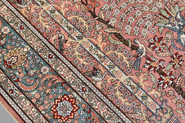An oriental silk rug, approx. 155 x 93 cm.