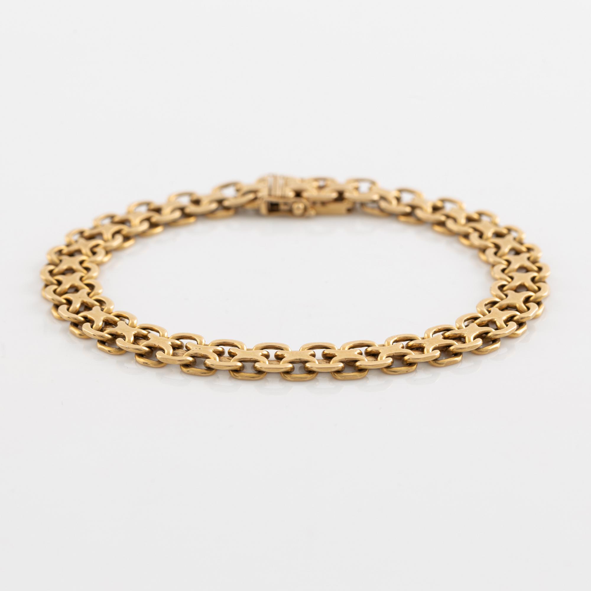 Armlänk, "x-länk", 18K guld. Bolidenguld.