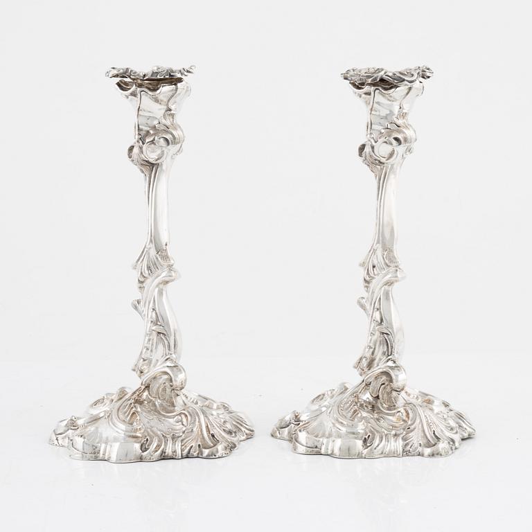A pair of rococo style silver candle sticks by Pehr Fredrik Palmgren, Stockhom 1851.