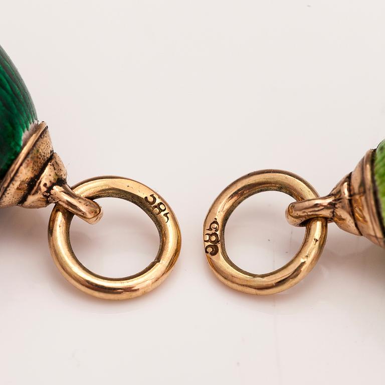 Two 14K gold pendants with enamel.