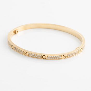 Cartier, "Love" bracelet, small model in 18K gold with brilliant-cut diamonds.