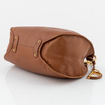 Christian Dior, a brown leather handbag.