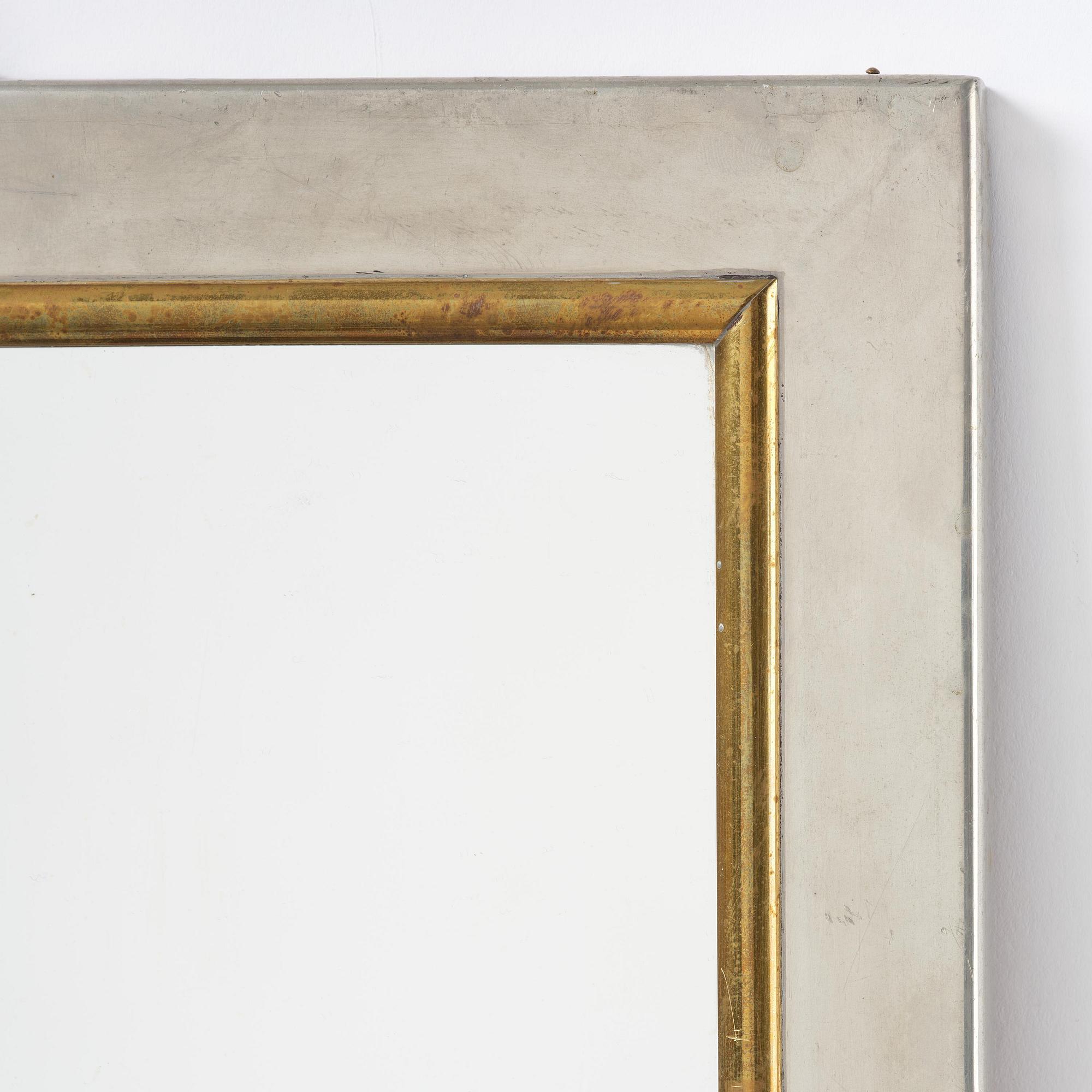 Firma Svenskt Tenn, a pewter and brass wall mirror model 2283, Firma Svenskt Tenn, Stockholm, 1952.