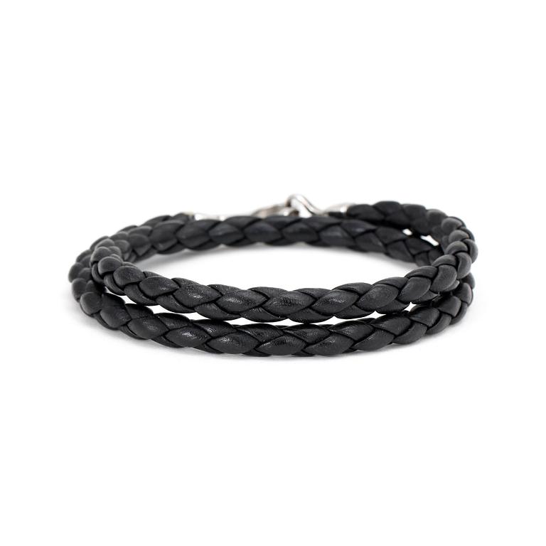 GUCCI. a black leather bracelet.