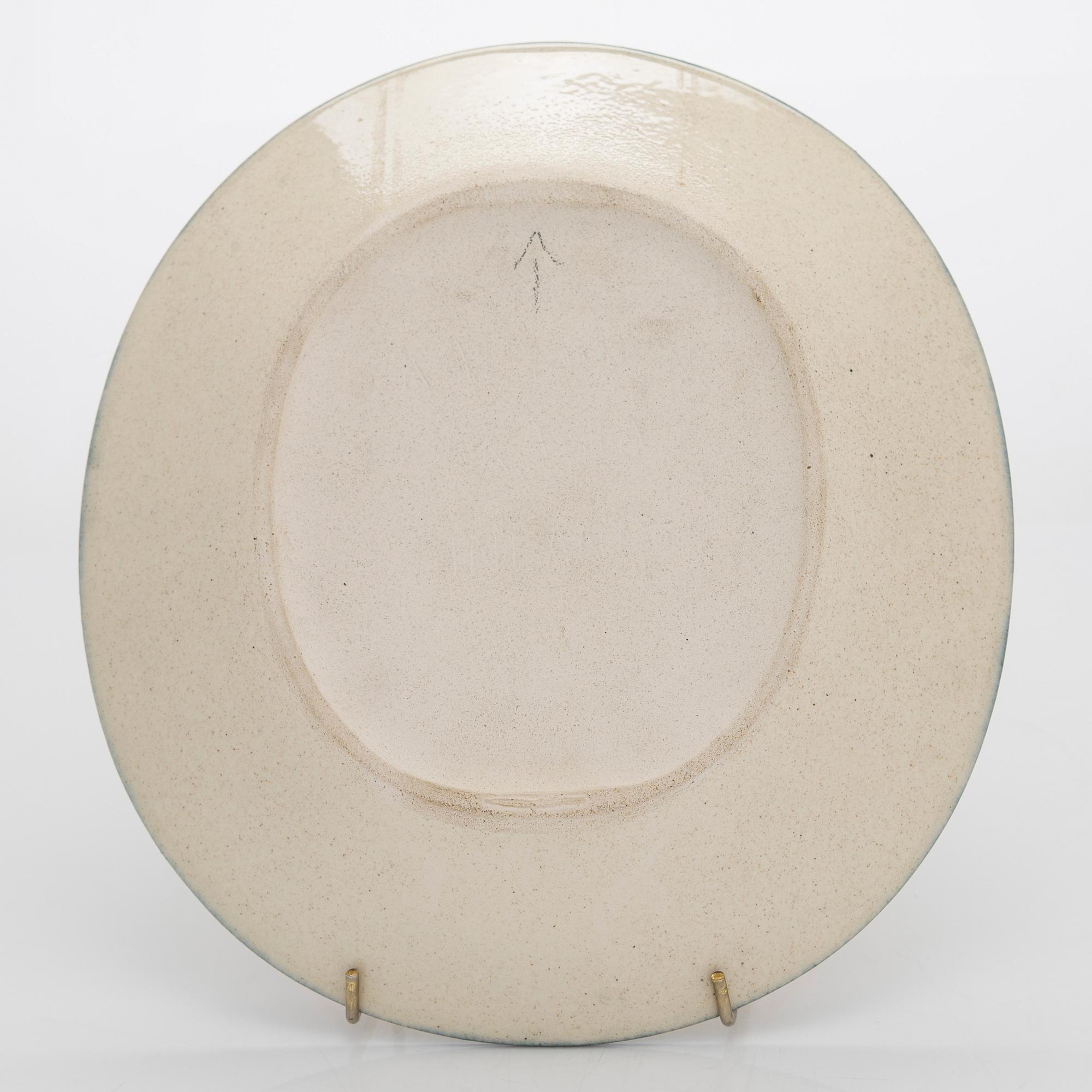 Birger Kaipiainen, a decorative stoneware plate signed Kaipiainen Arabia Finland.