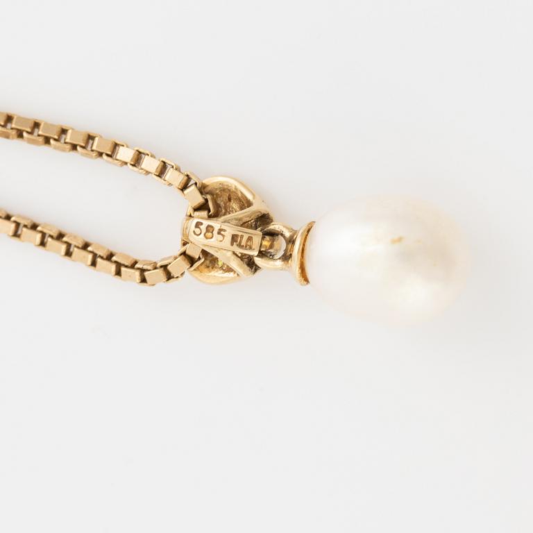 Cultured pearl and heart with small brilliant cut diamond necklace.