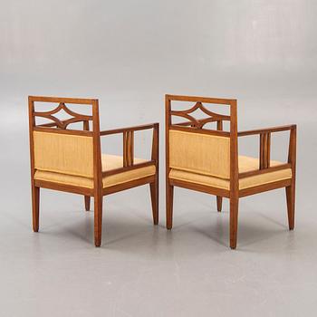 A pair of armchairs around 1900.