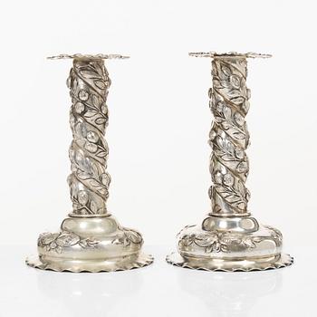 A pair of Baroque-style silver candle sticks, with Swedish import marks, first half of the 20th century.