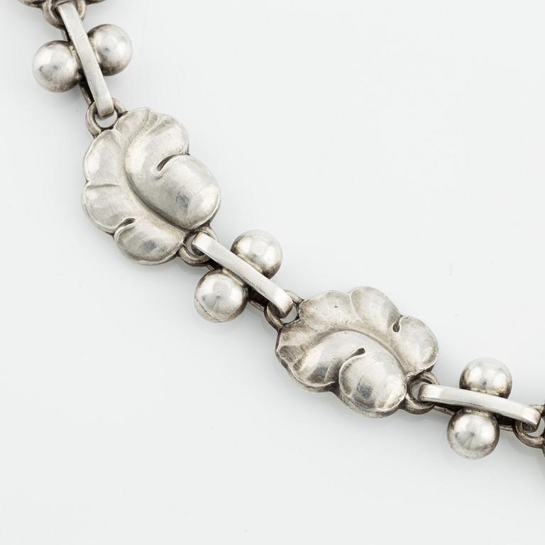 Harald Nielsen, a sterling silver necklace, a brooch, and a pair of earrings, for Georg Jensen, Denmark post 1945.