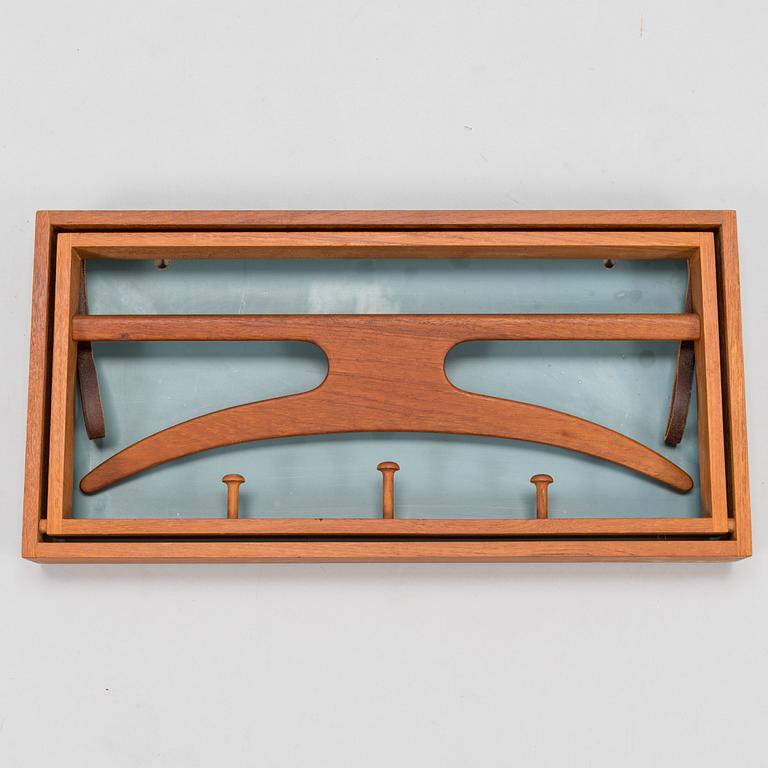 A mid-20th-Century Danish clothes rack by Adam Hoff & Poul Östergaard, Virum Möbelsnickeri.
