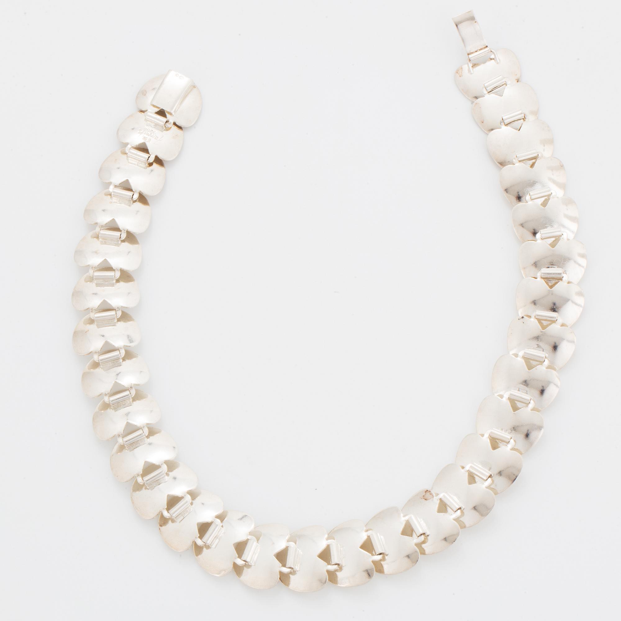 A silver necklace by Viggo Wollny.