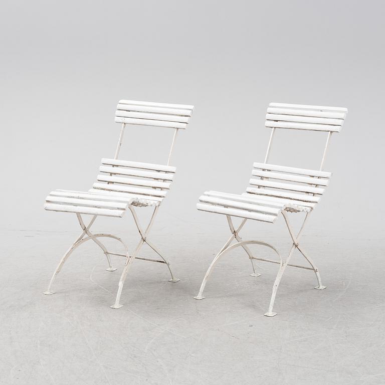 A garden sofa and four chairs, mid 20th Century.