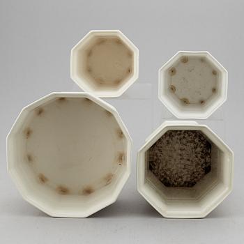 A set of four white glazed "Waldemarsudde" flower pots, Gustavsberg, Sweden, 20th Century.