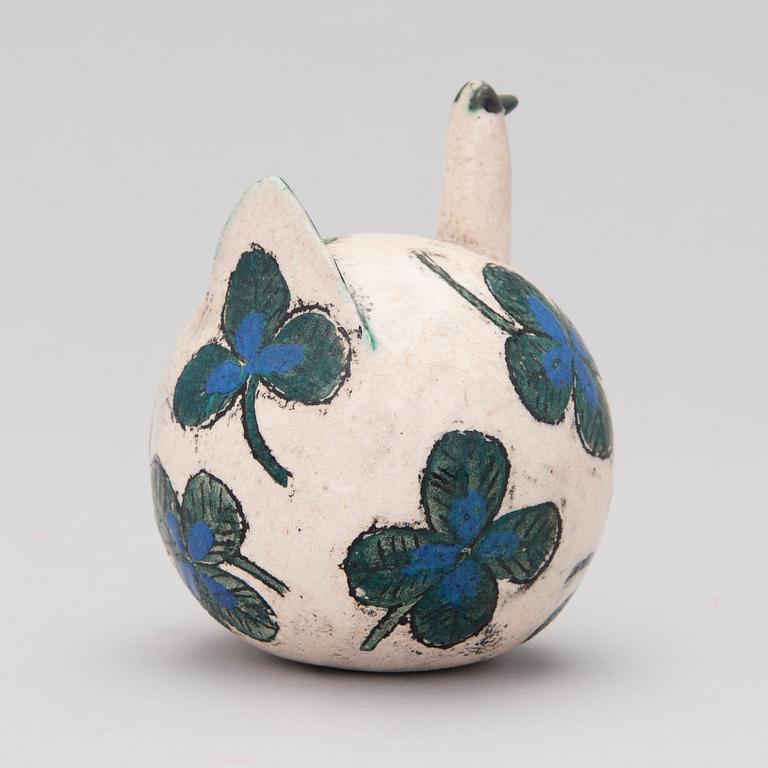 A ceramic bird signed Kaipiainen.