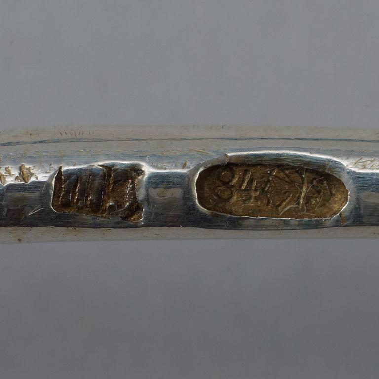 A set of four Russian silver-gilt and enamel coffee-spoons, unidentified makers mark, Moscow 1899-1908.