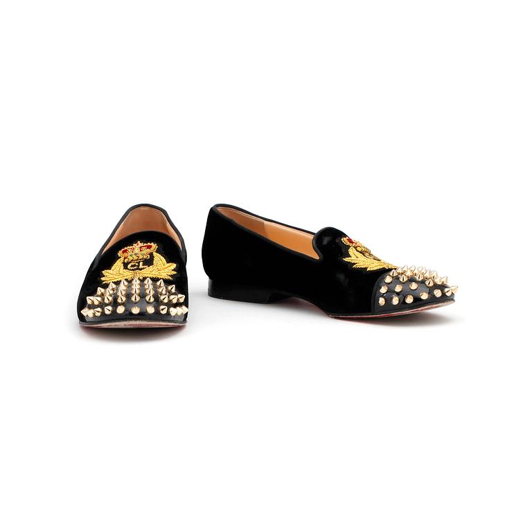 CHRISTIAN LOUBOUTIN, a pair of black velvet loafers with golden spikes, "Intern". Size 36,5.