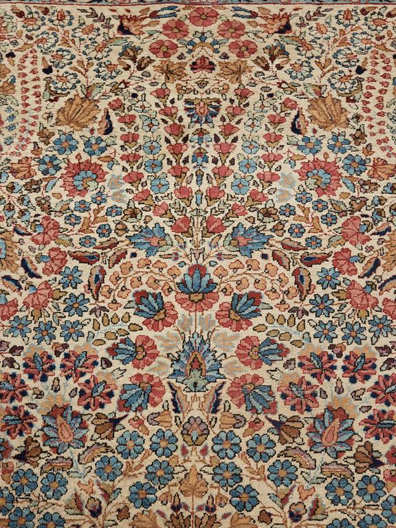 A semi-antique/old Kerman carpet, around 361 x 264 cm.