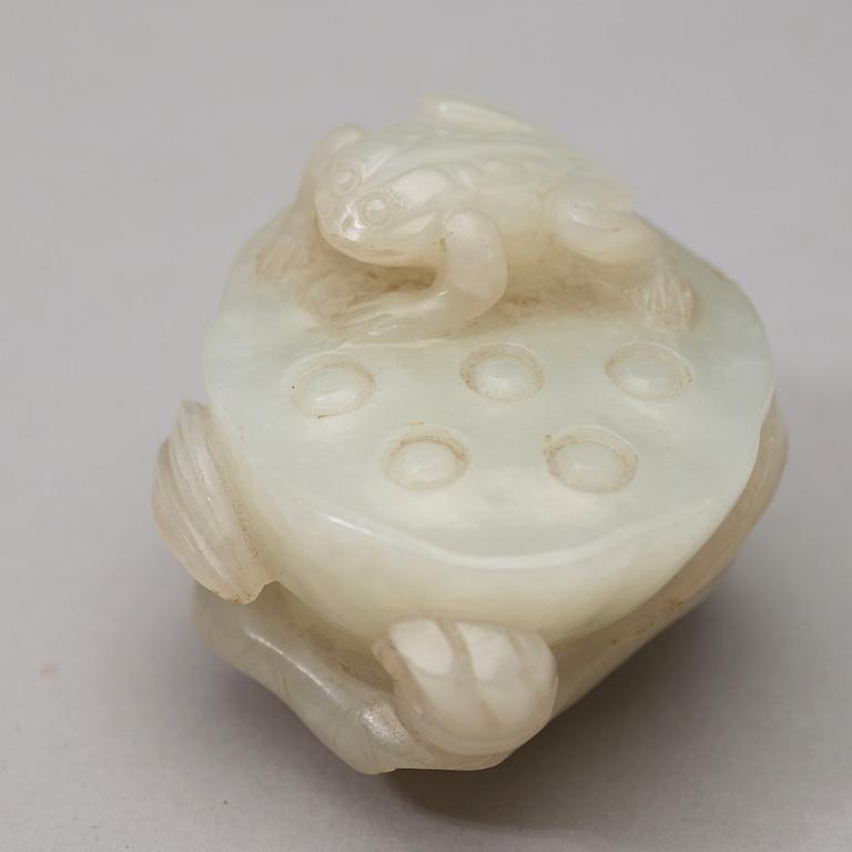 A pale celadon nephrite carving of a lotus pod, Qing dynasty (1644-1912).