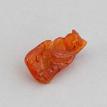 A group of amber objects, China, 20th Century. (14 small pieces).