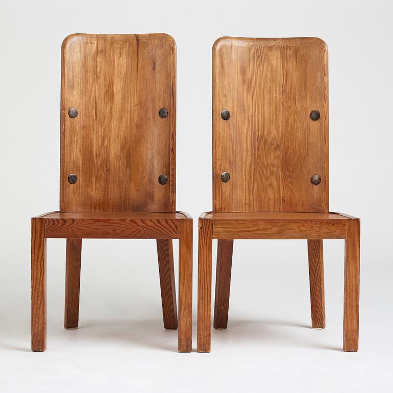 Axel Einar Hjorth, a pair of stained pine "Lovö" chairs, Nordiska Kompaniet, Sweden 1930's.