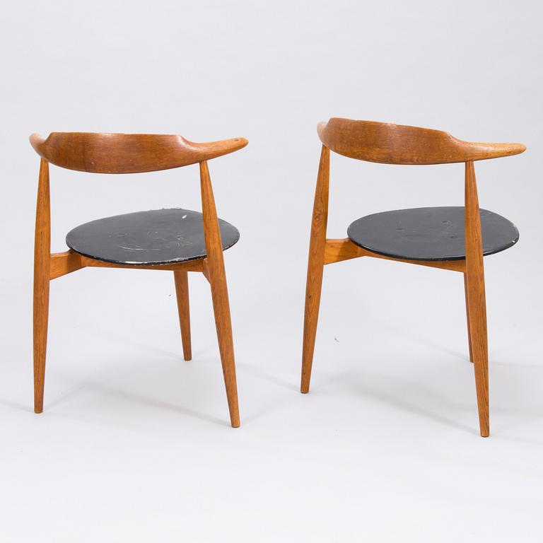 A pair of "Hjertestolen" by Hans J Wegner produced for Fritz Hansen.