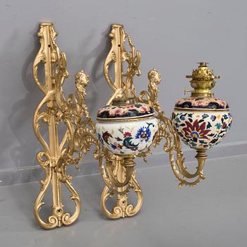 A pair of wall paraffin lamps, turn of the century 1900. Made by Ljungdells Malmö Sweden.