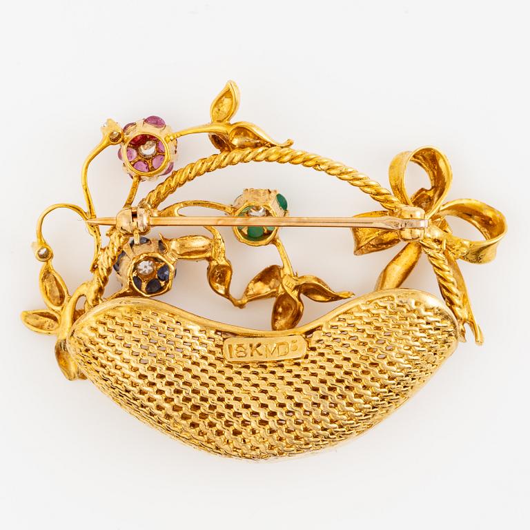 Brosch, i form av blomsterkorg, 18K guld med rubiner, kalcedon, safirer och diamanter.