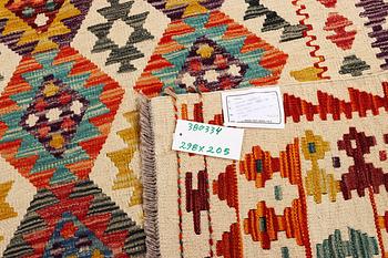 A Kilim carpet, c. 298 x 205 cm.