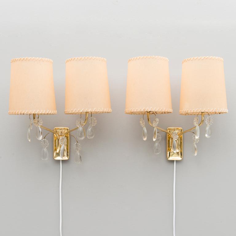 A pair of early 1950s '9413' wall lights for Taito, Finland.