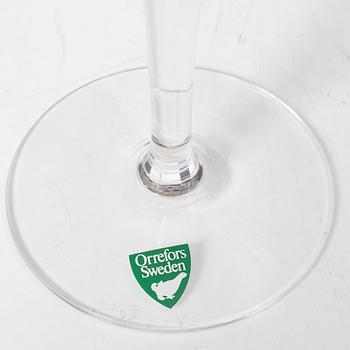 A set of 46 glass service parts, including 'Elixir Connoisseur' and Gunnar Cyrén, 'Optica', Orrefors.