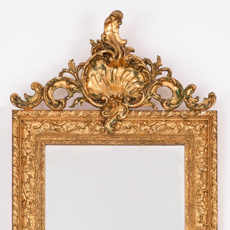 A mirror and a console table, around the year 1900.