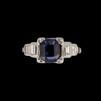 175. A sapphire and baguette cut diamond ring.