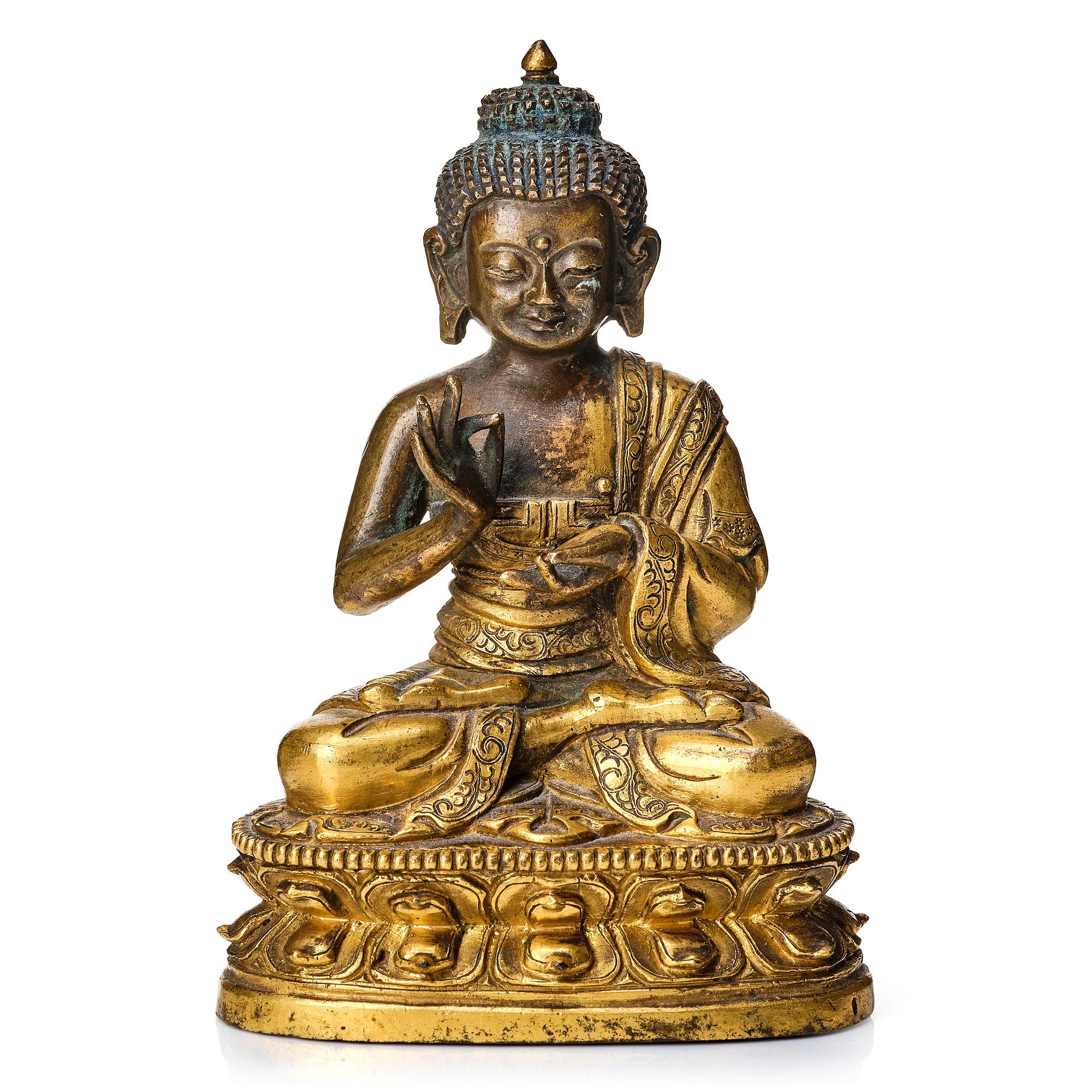 A partly gilt Tibeto-Chinese figure of Maitreya Buddha, 17th century.