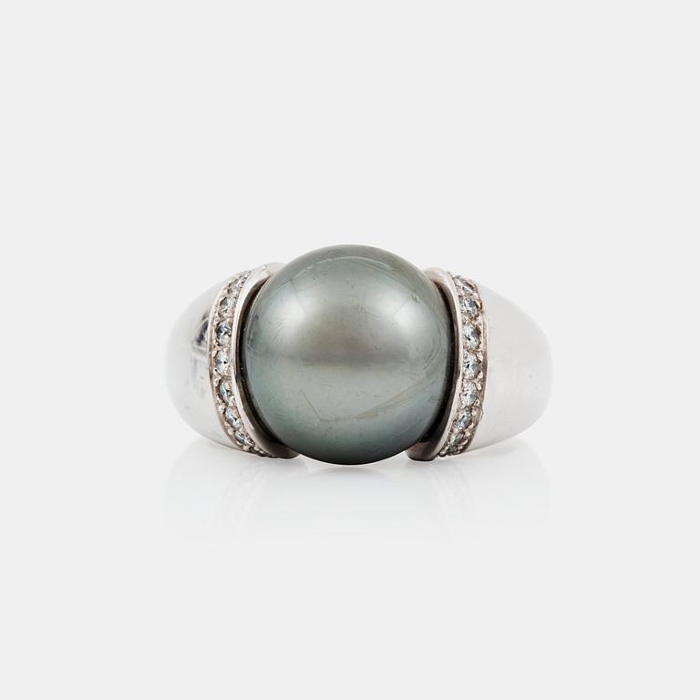 A cultured Tahiti pearl and diamond ring made by Gübelin.