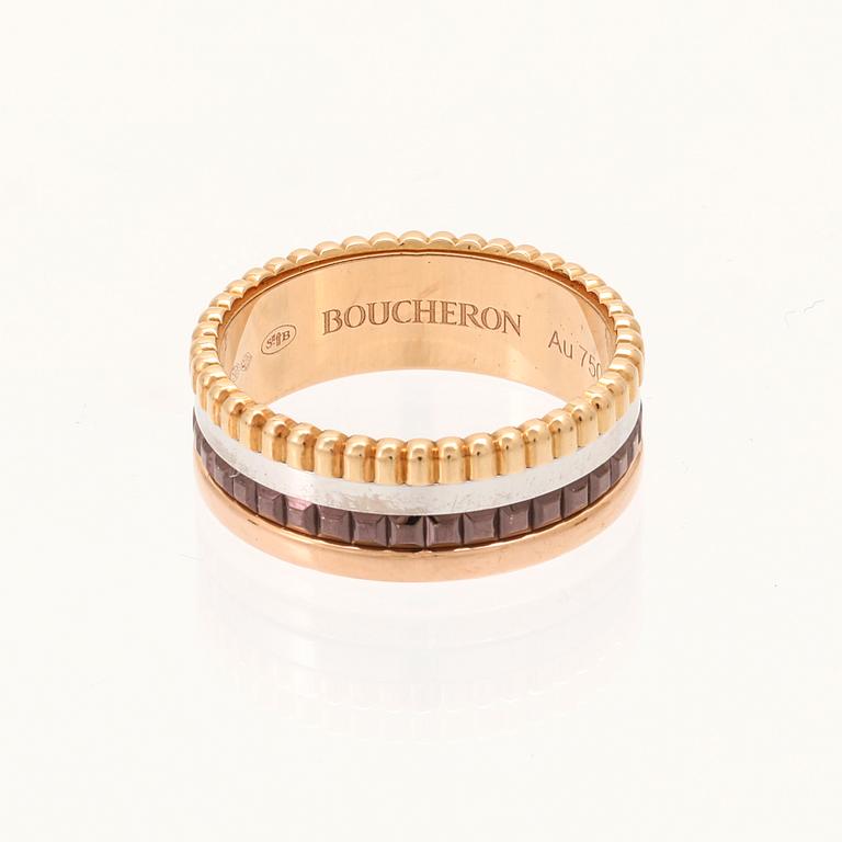 A “Quatre” ring in 18K yellow, pink, white gold and brown PVD by Boucheron.