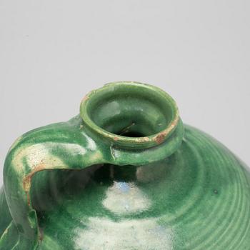 A green glazed ceramic bottle/jar, late Ming dynasty.